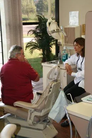 An image of the doctor talking with a patient