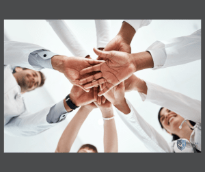dentists holding hands as a team